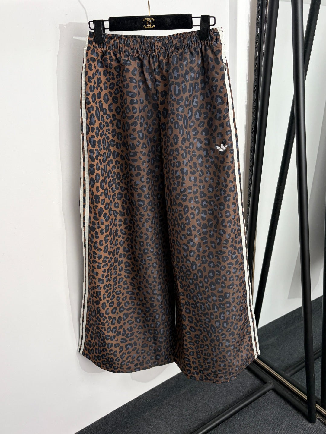 Leopard-print zip-up jacket + high-waisted wide-leg trousers