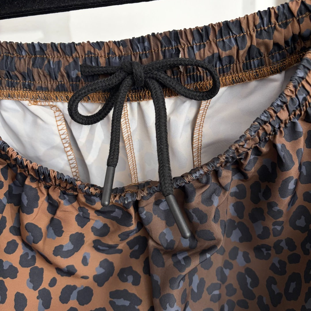 Leopard-print zip-up jacket + high-waisted wide-leg trousers