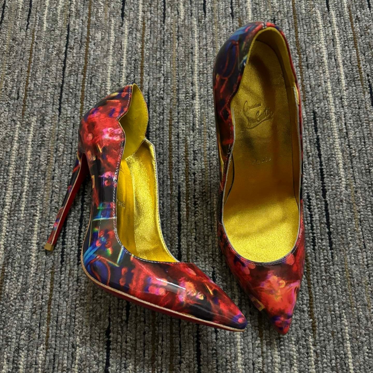 Christia** Loubout** floral high heels