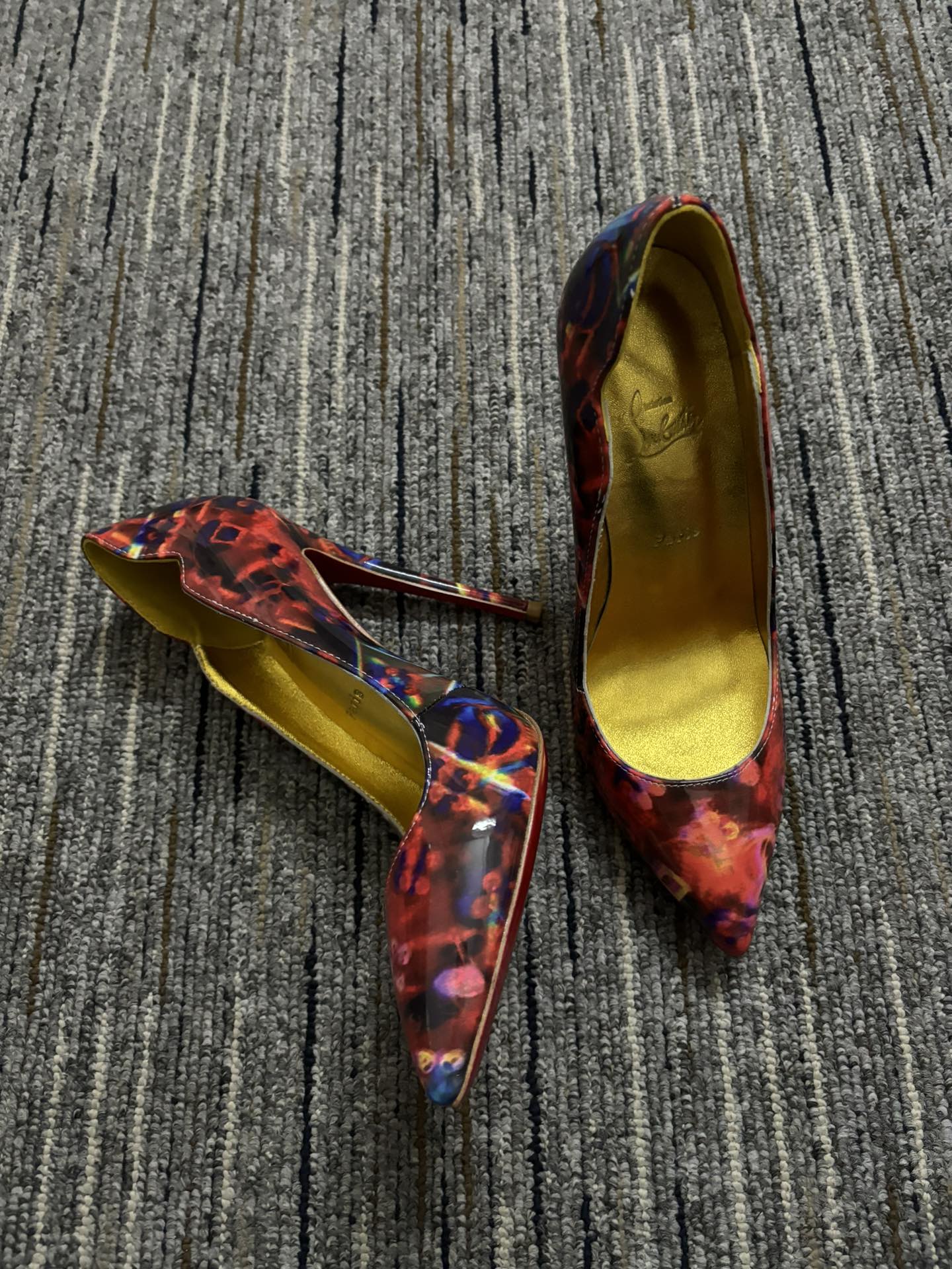 Christia** Loubout** floral high heels