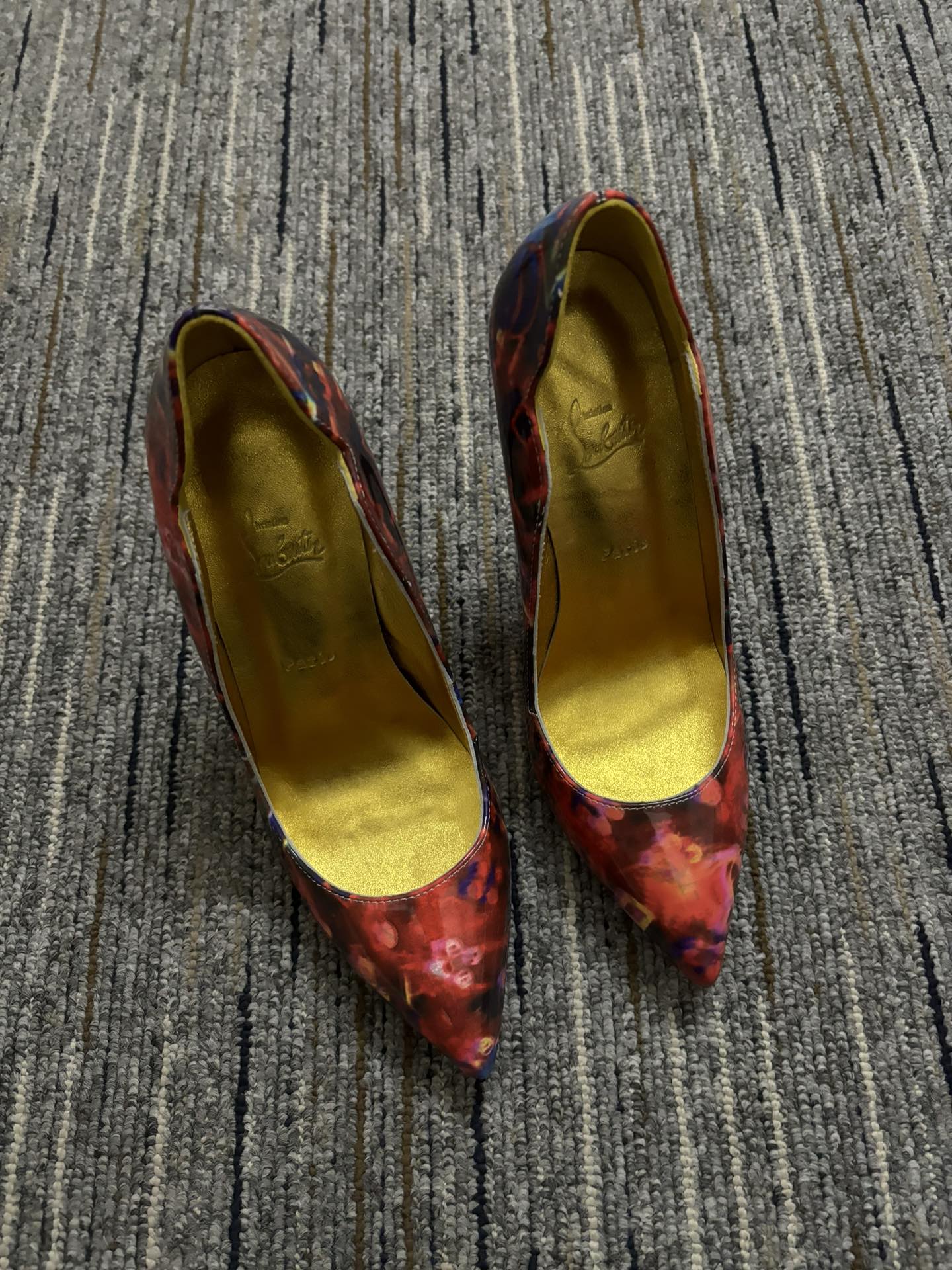 Christia** Loubout** floral high heels