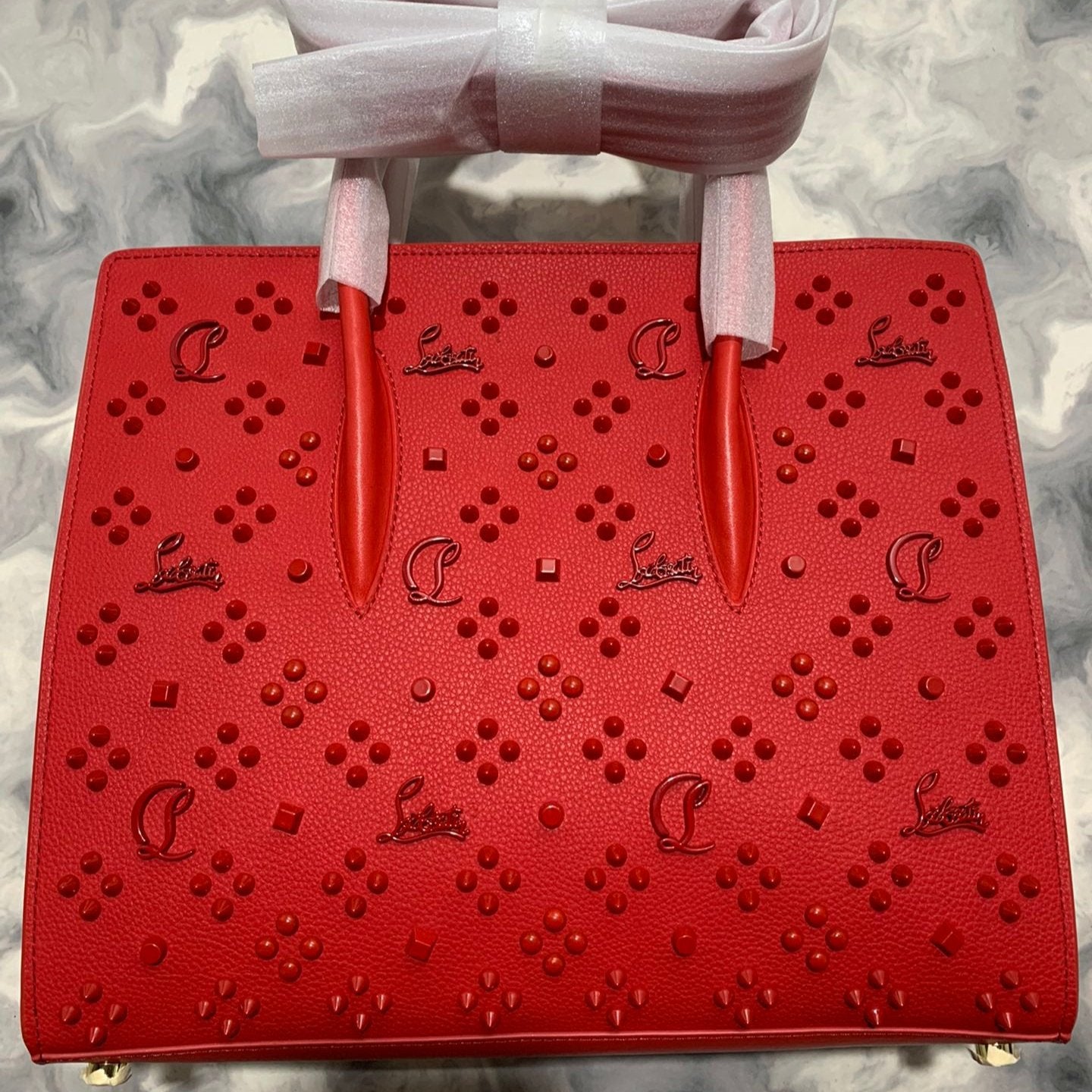 Christi** Loubout** red handbag