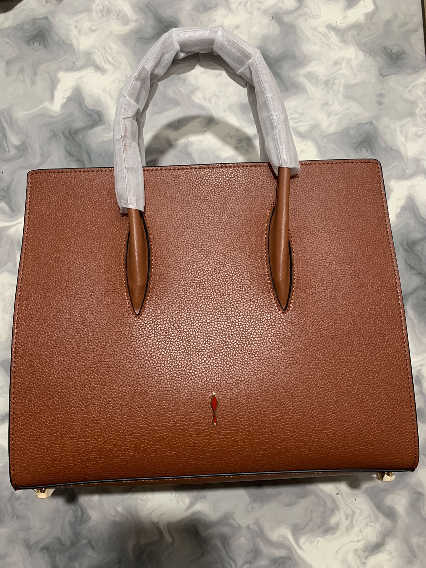 Christi** Loubout** red handbag