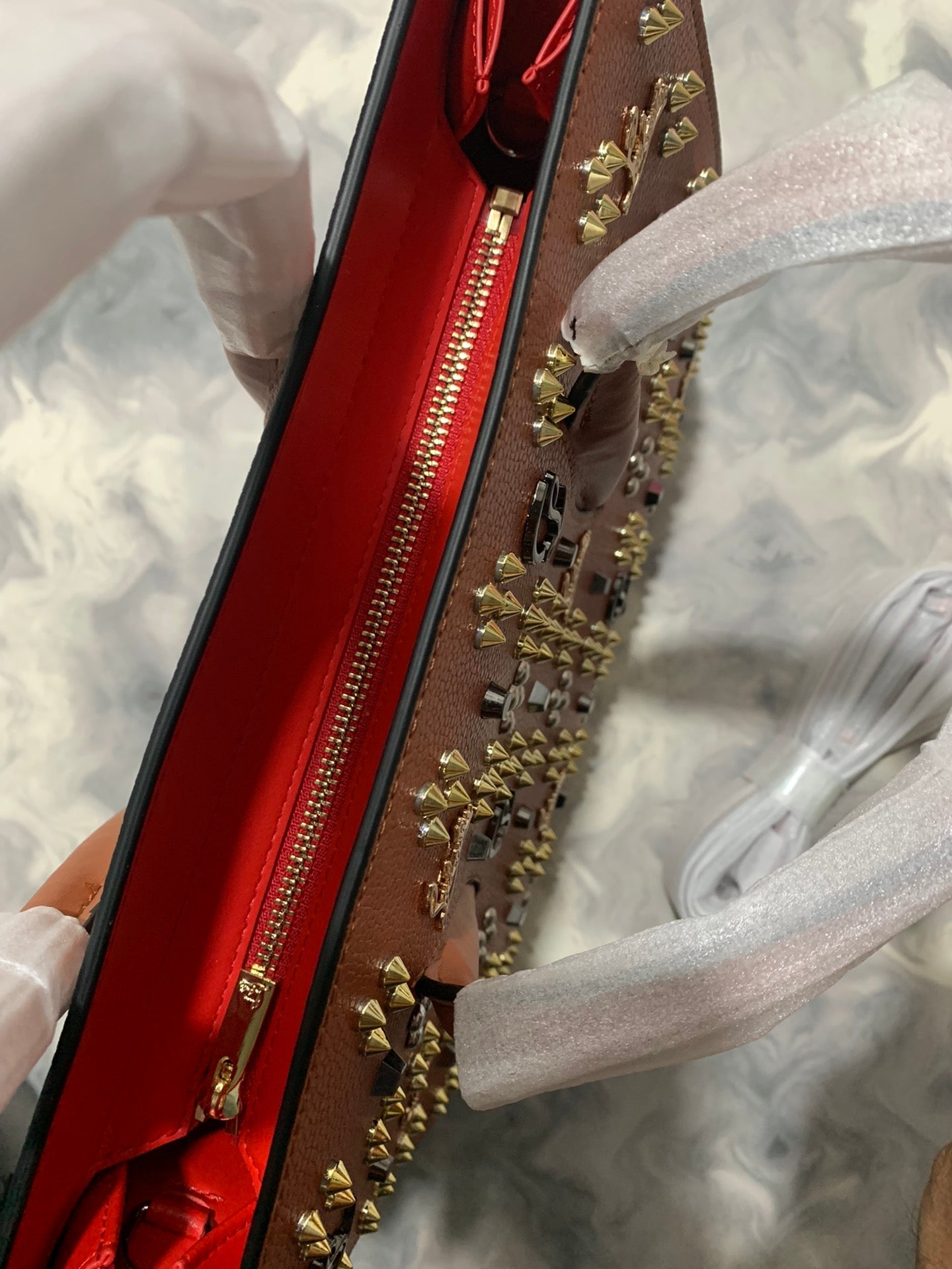 Christi** Loubout** red handbag