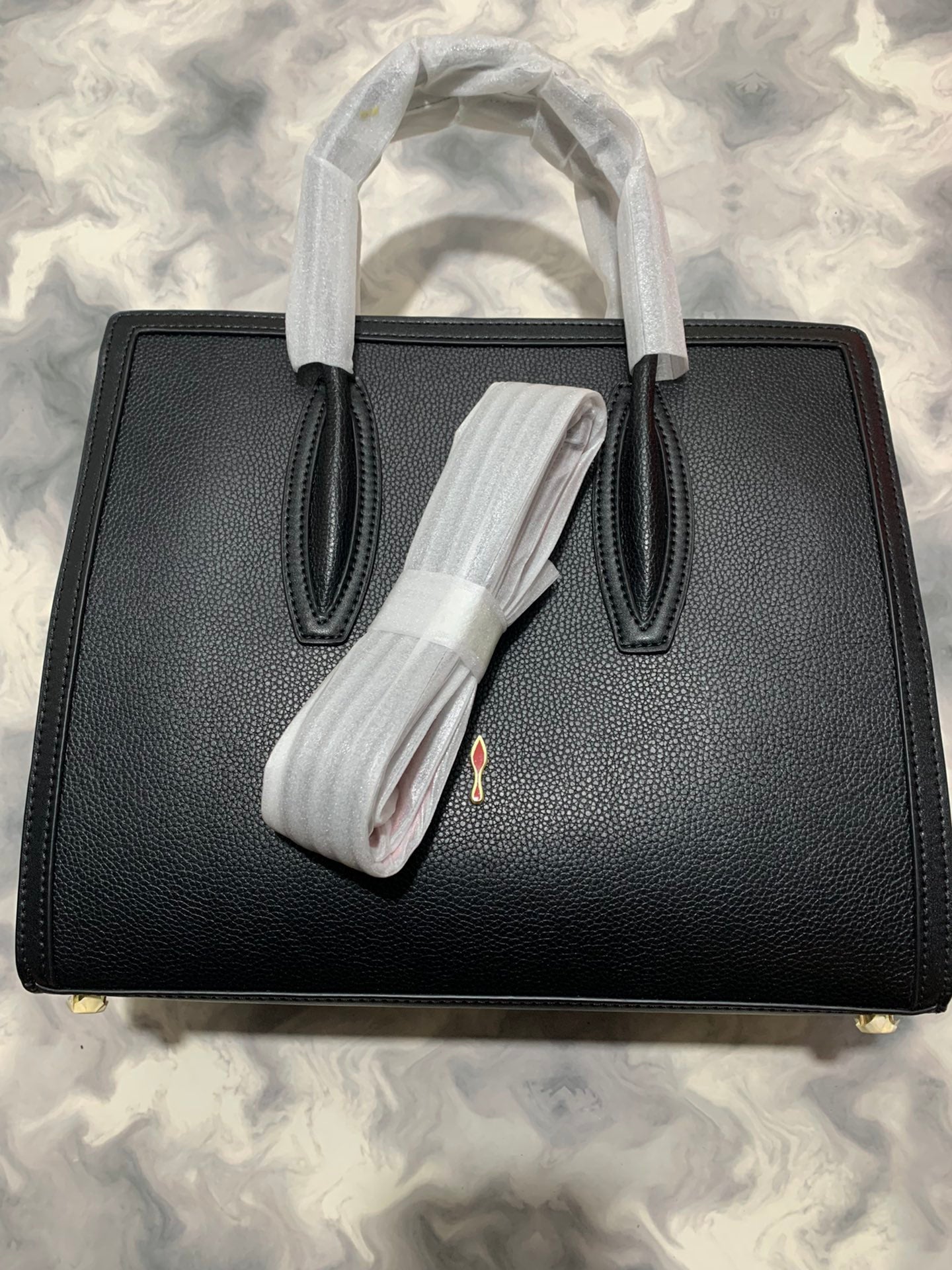 Christi** Loubout** red handbag