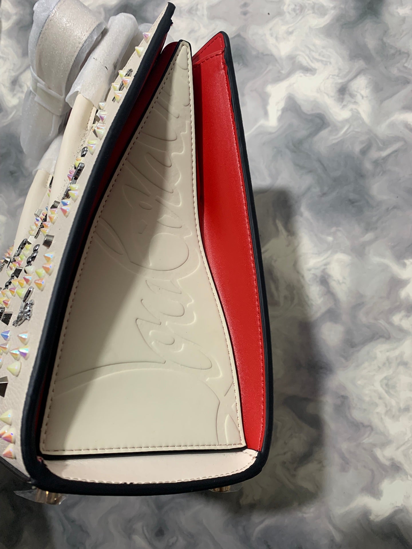 Christi** Loubout** red handbag